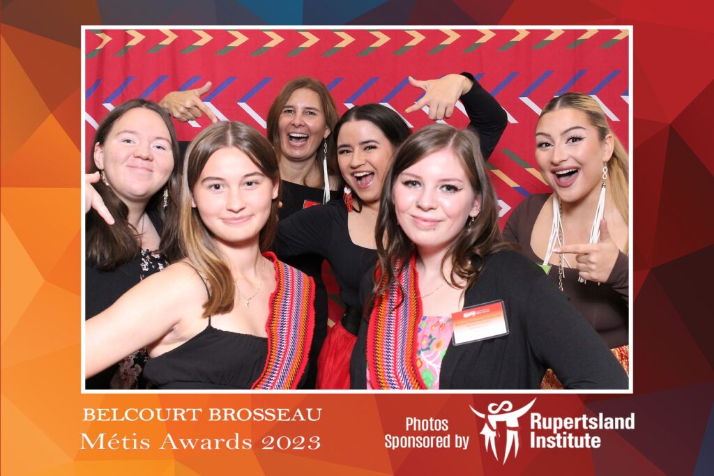 Grad party photo booth rental setup by Hip Image for the Belcourt Brosseau Métis Awards 2023, sponsored by Rupertsland Institute, featuring the Belcourt Brosseau Métis Awards logo and the text "Photos."